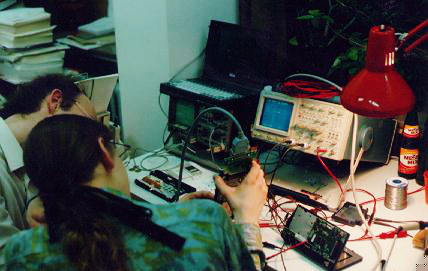 two people at oscilloscope
